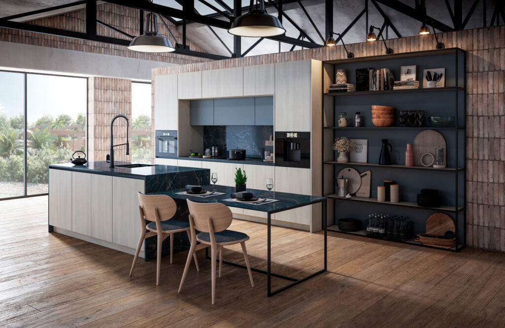 Composición de cocina en línea que se completa con una isla acabada en mesa de desayunos.